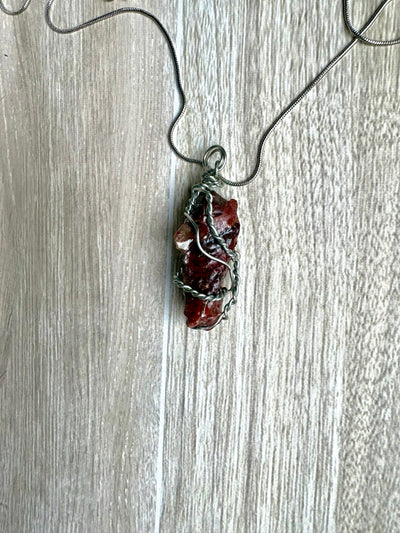 Necklace with a red calcite stone pendant