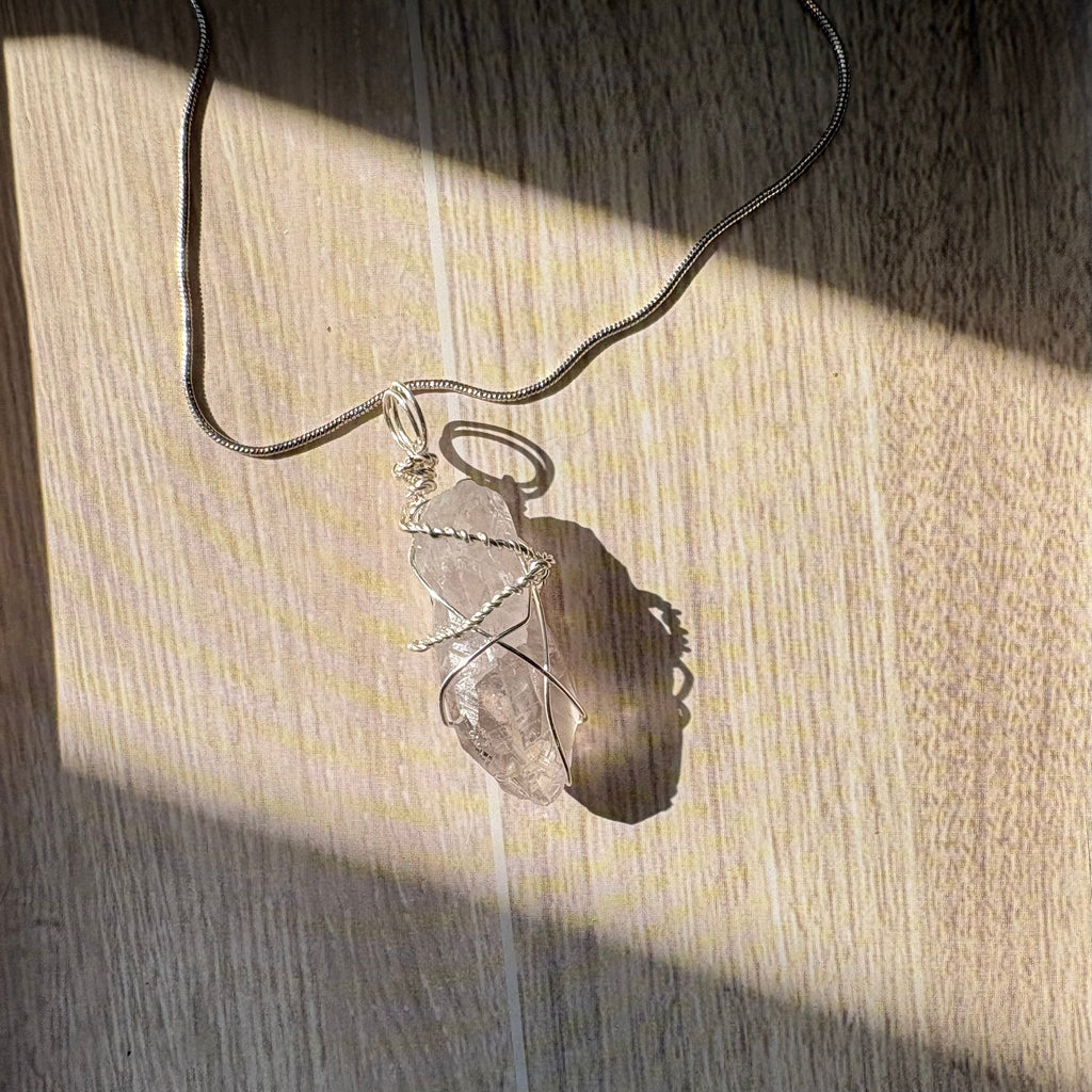 Necklace with a clear quartz stone pendant necklace