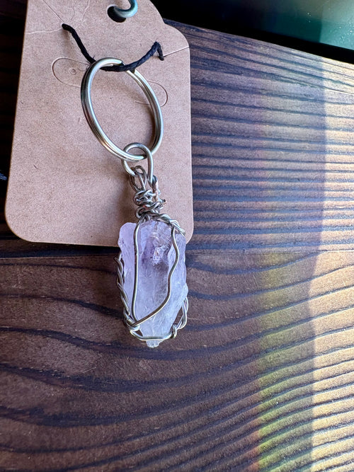 keychain with an amethyst crystal wrapped in copper wire