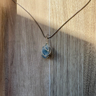 Blue calcite crystal stone wrapped in wire